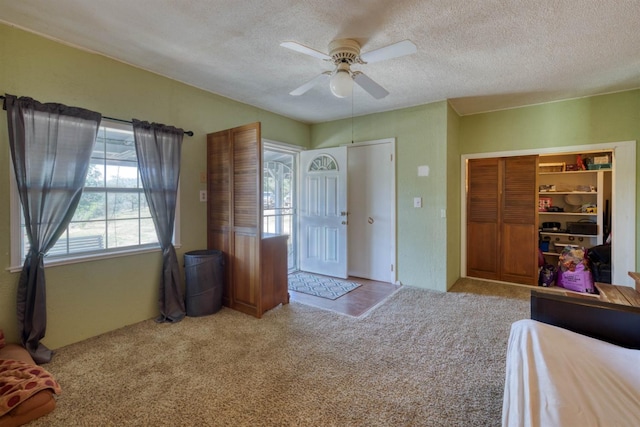 28302 Tollhouse Rd, Tollhouse, CA 93667 - unfurnished bedroom with carpet, a textured ceiling, a closet, and a ceiling fan