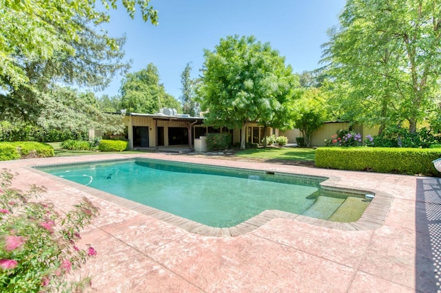 outdoor pool with a patio