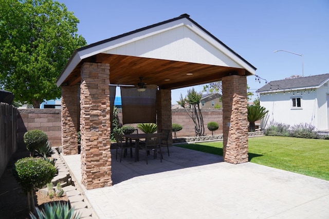 view of patio with a ceiling fan and outdoor dining space