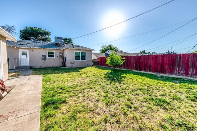 view of yard with central AC