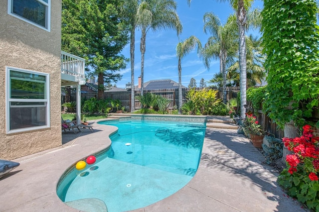 view of pool featuring a fenced backyard and a patio area
