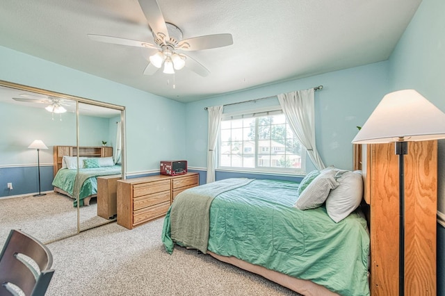 bedroom featuring carpet, a closet, and ceiling fan