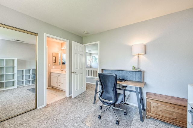 office space with light colored carpet and baseboards