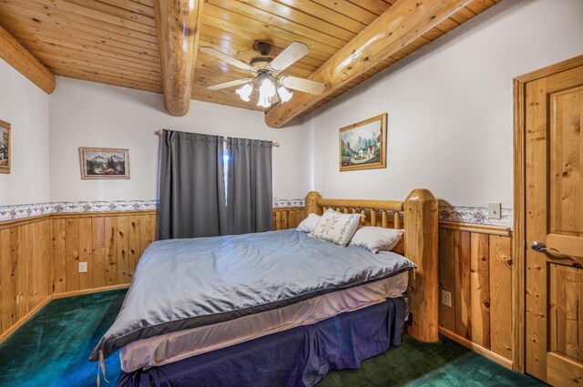 55585 Flintridge Dr, Shaver Lake, CA 93664 - bedroom with dark colored carpet, wooden ceiling, wainscoting, beam ceiling, and wooden walls