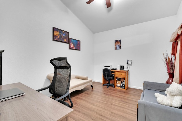 office featuring lofted ceiling, ceiling fan, light wood-style flooring, and baseboards