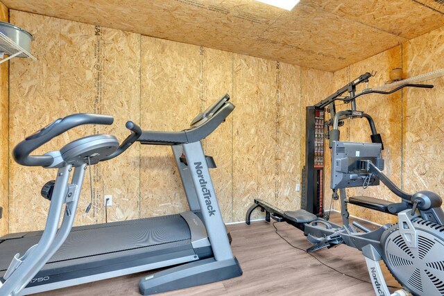 exercise area featuring wood finished floors