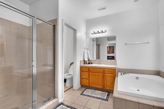 bathroom featuring a shower stall, tile patterned flooring, vanity, and a garden tub