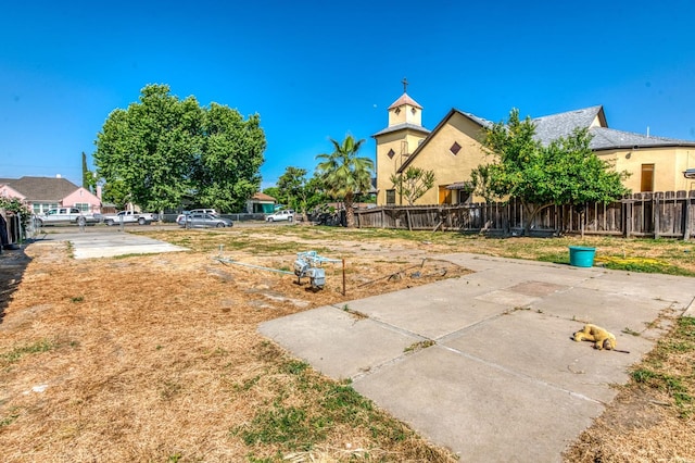 view of yard with fence and a patio area