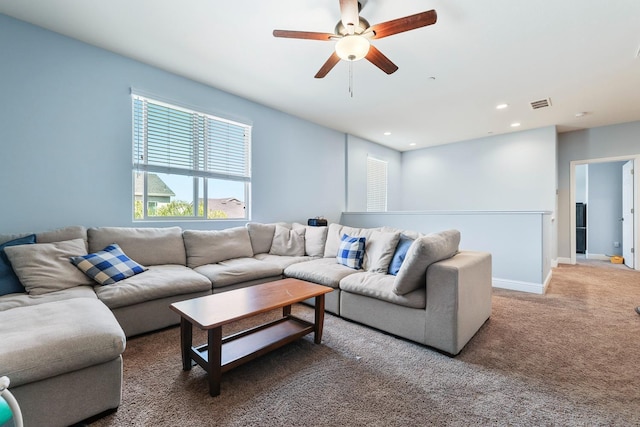 carpeted living area featuring ceiling fan, recessed lighting, and baseboards