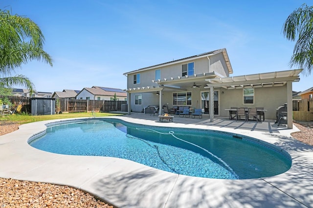 view of pool with a fenced backyard, a pergola, ceiling fan, a patio, and outdoor dining space