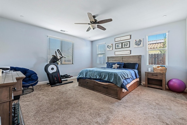 bedroom with carpet, multiple windows, ceiling fan, and baseboards