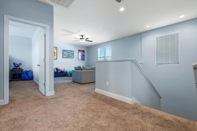 corridor featuring an upstairs landing, carpet flooring, baseboards, and recessed lighting