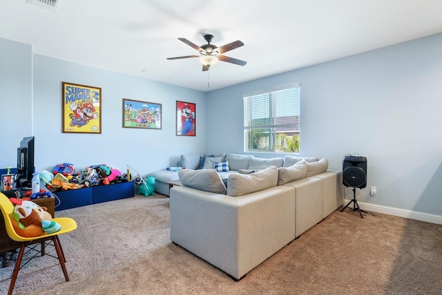 living area with carpet flooring, a ceiling fan, and baseboards