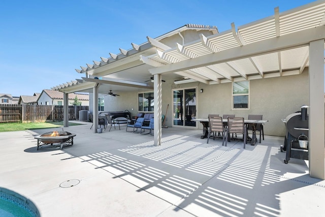 view of patio / terrace with an outdoor fire pit, fence, a pergola, and ceiling fan