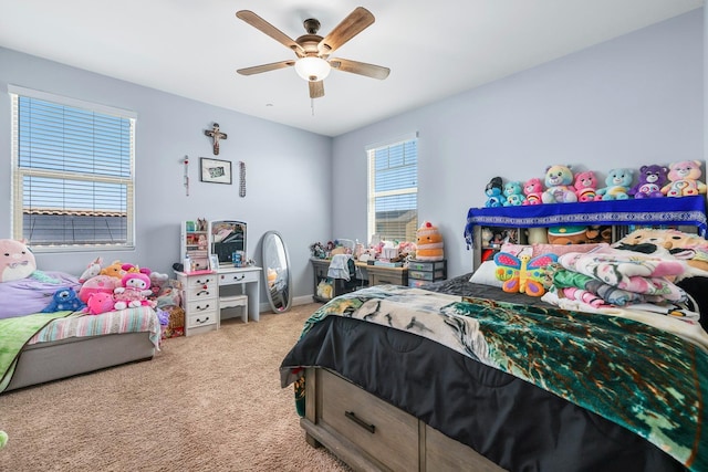 carpeted bedroom featuring a ceiling fan and baseboards