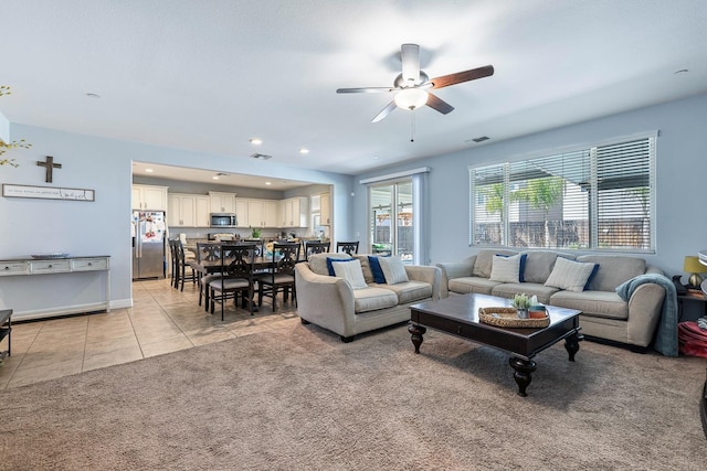 2933 N Hornet Ave, Fresno, CA 93737 - living room with ceiling fan, light tile patterned flooring, light colored carpet, and recessed lighting