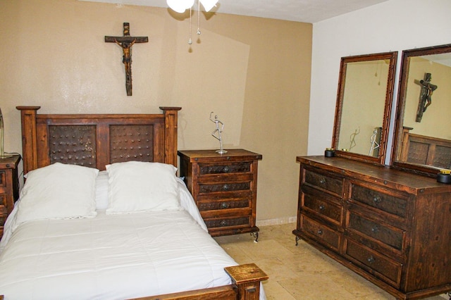 bedroom featuring baseboards