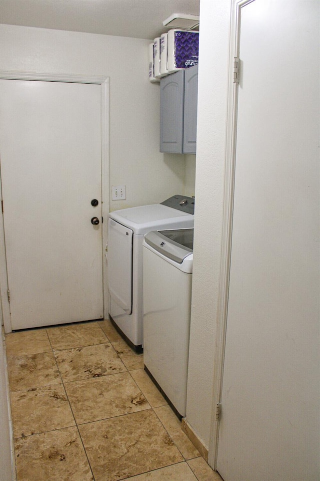 3694 W Robinson Ave, Fresno, CA 93722 - washroom with washing machine and dryer, cabinet space, and light tile patterned floors