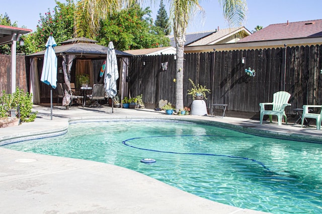 3694 W Robinson Ave, Fresno, CA 93722 - view of swimming pool with a gazebo, a fenced backyard, and a patio area