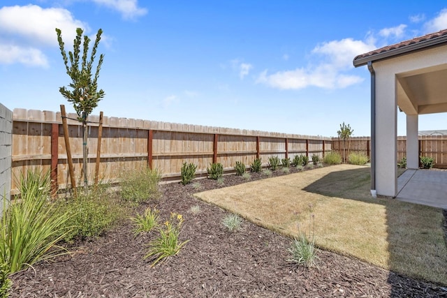 fenced backyard with a patio