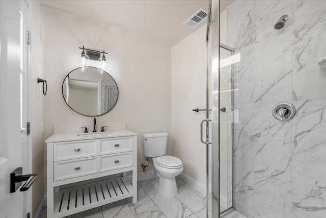 5706 N Tamera Ave, Fresno, CA 93711 - bathroom with a marble finish shower, marble finish flooring, toilet, vanity, and baseboards
