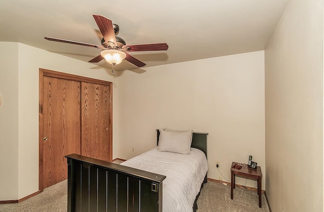1025 E Cambridge Ave, Visalia, CA 93292 - bedroom featuring light carpet, a closet, baseboards, and a ceiling fan