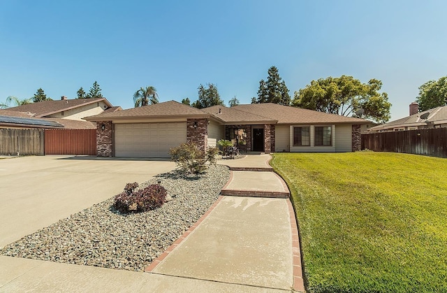 1025 E Cambridge Ave, Visalia, CA 93292 - ranch-style home with an attached garage, concrete driveway, and brick siding