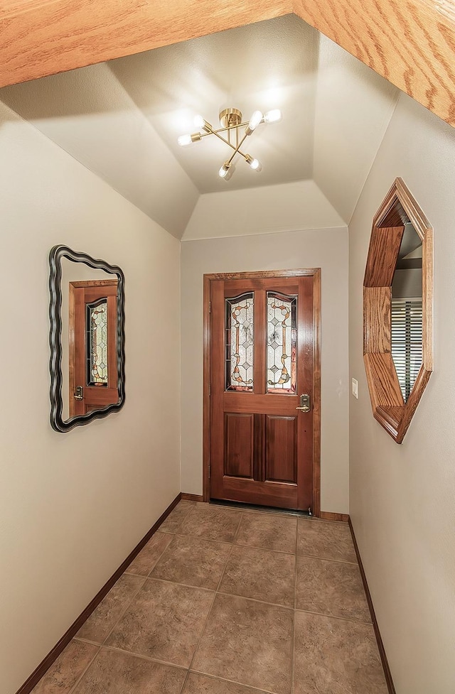 1025 E Cambridge Ave, Visalia, CA 93292 - entryway with a chandelier, baseboards, and vaulted ceiling