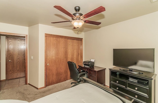 1025 E Cambridge Ave, Visalia, CA 93292 - carpeted bedroom with a closet, baseboards, a ceiling fan, and tile patterned floors