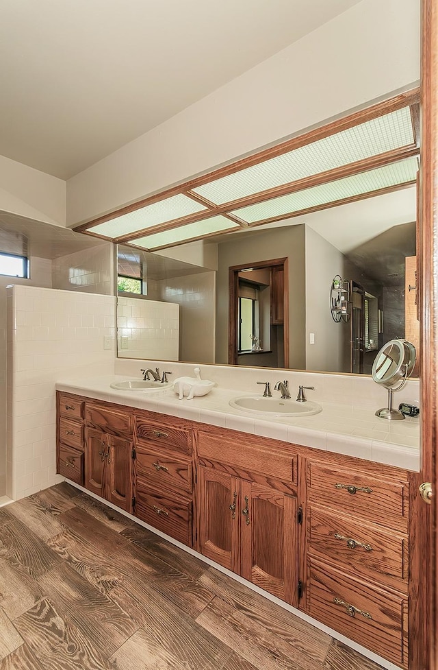 1025 E Cambridge Ave, Visalia, CA 93292 - bathroom with double vanity and wood finished floors