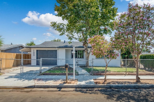153 Birch, Fresno, CA 93650 - view of front of house featuring a garage, stucco siding, a fenced front yard, concrete driveway, and a gate
