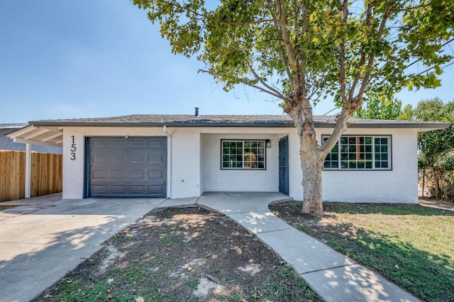 153 Birch, Fresno, CA 93650 - single story home with stucco siding, fence, an attached garage, and driveway
