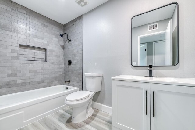 153 Birch, Fresno, CA 93650 - bathroom with toilet, wood finished floors, shower / bath combination, vanity, and baseboards