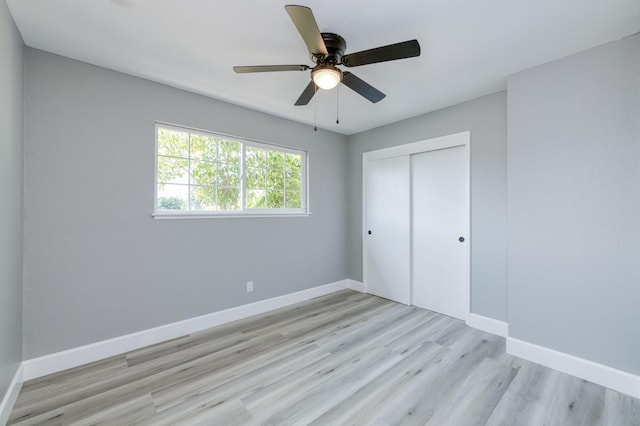 153 Birch, Fresno, CA 93650 - unfurnished bedroom featuring light wood-style flooring, baseboards, a closet, and ceiling fan