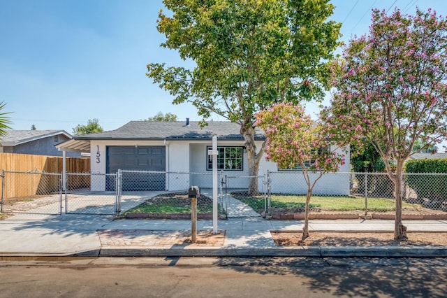 153 Birch, Fresno, CA 93650 - view of front facade featuring a garage, stucco siding, a fenced front yard, concrete driveway, and a gate