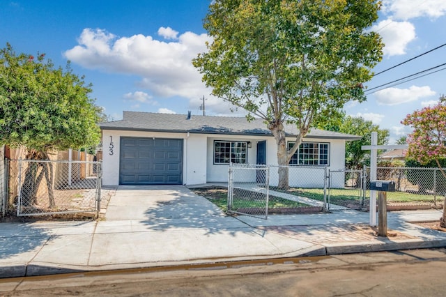 153 Birch, Fresno, CA 93650 - view of front of house with stucco siding, a gate, a garage, and concrete driveway