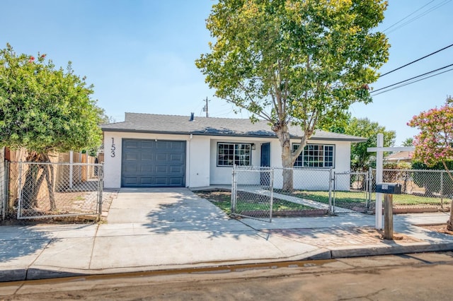 153 Birch, Fresno, CA 93650 - view of front of house featuring stucco siding, a gate, a garage, and driveway