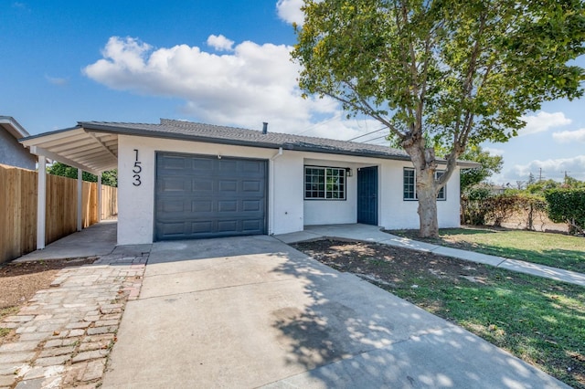 153 Birch, Fresno, CA 93650 - single story home featuring stucco siding, driveway, and a garage