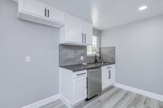 153 Birch, Fresno, CA 93650 - kitchen with dishwasher, a sink, baseboards, light wood-style floors, and backsplash