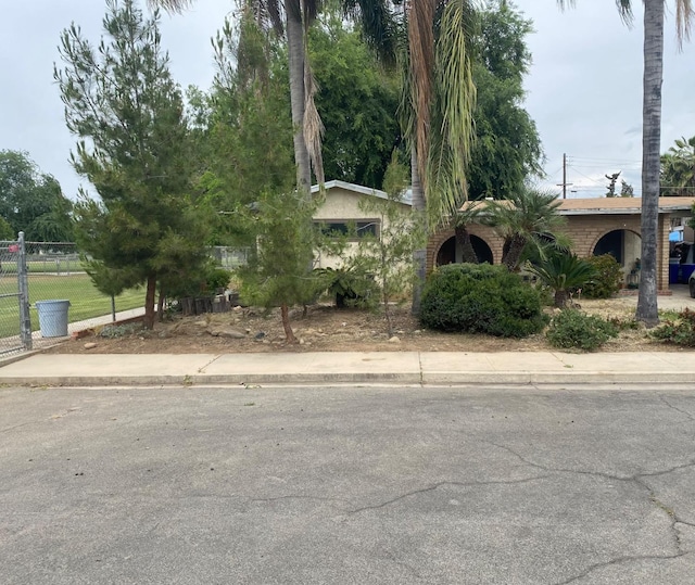 obstructed view of property with fence