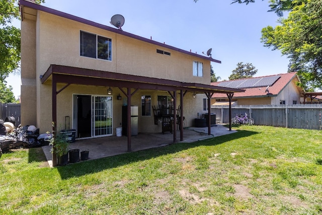 3626 E Stewart Ct, Visalia, CA 93292 - back of house featuring stucco siding and a patio area