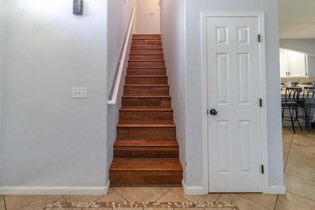 3626 E Stewart Ct, Visalia, CA 93292 - stairs with tile patterned floors and baseboards