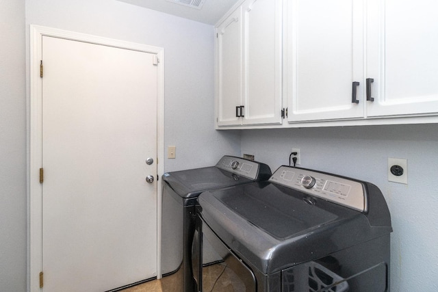 3626 E Stewart Ct, Visalia, CA 93292 - laundry room featuring cabinet space and washing machine and dryer