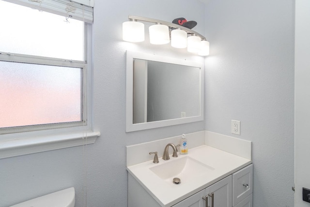 3626 E Stewart Ct, Visalia, CA 93292 - half bathroom featuring healthy amount of natural light, toilet, and vanity