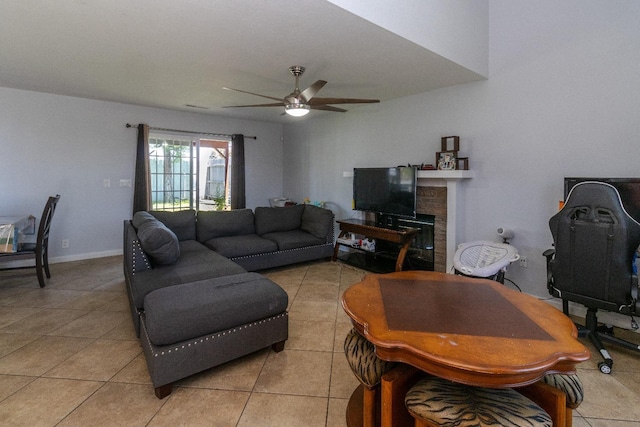 3626 E Stewart Ct, Visalia, CA 93292 - living room featuring light tile patterned floors, ceiling fan, a fireplace, and baseboards