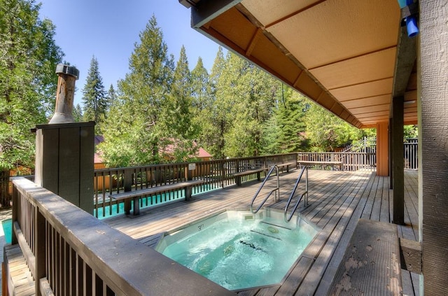 wooden deck featuring an in-ground hot tub