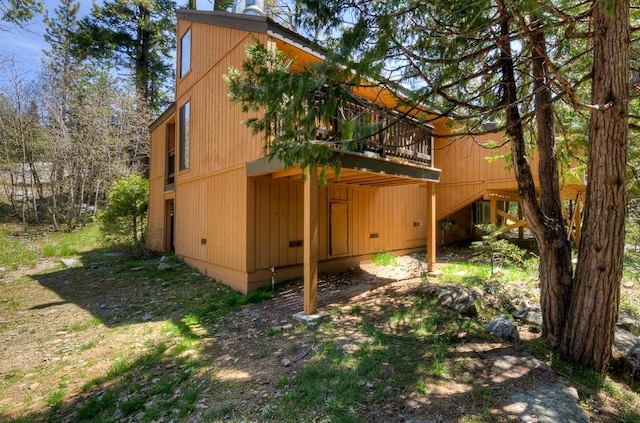 view of side of property featuring a deck