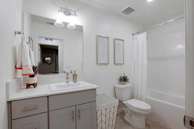 1890 Richard Ave Unit 2054S, Sanger, CA 93657 - bathroom featuring toilet, vanity, tile patterned flooring, and shower / bath combo with shower curtain