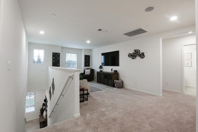 1890 Richard Ave Unit 2054S, Sanger, CA 93657 - living room with healthy amount of natural light, recessed lighting, carpet flooring, and baseboards