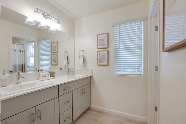 1890 Richard Ave Unit 2054S, Sanger, CA 93657 - bathroom featuring tile patterned flooring, double vanity, and baseboards